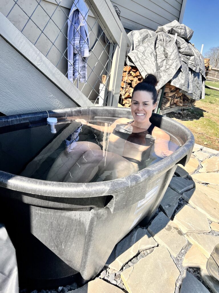 Jess smiling in the cold plunge tub