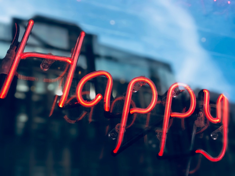 How does happiness and eudaimonia differ?